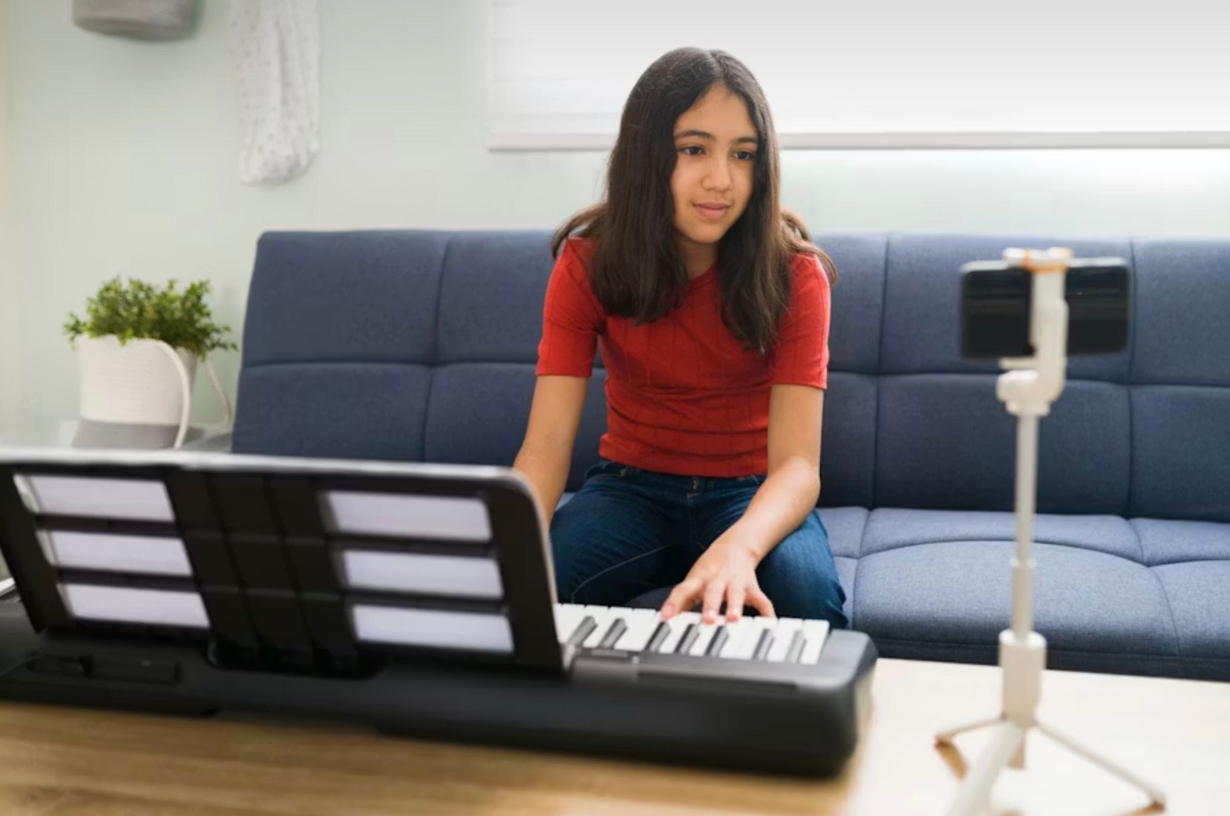 Beginner pianist hands on a digital piano keyboard during practice  